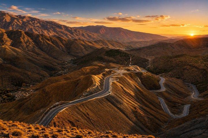 Winding mountain road through the High Atlas at sunset